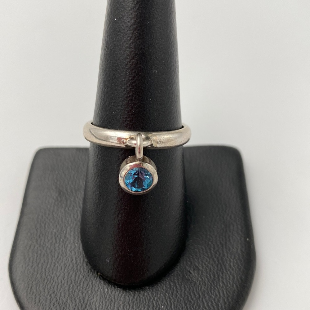 Blue topaz sterling silver charm ring. Stamped 925. Brand new. Size 8.5